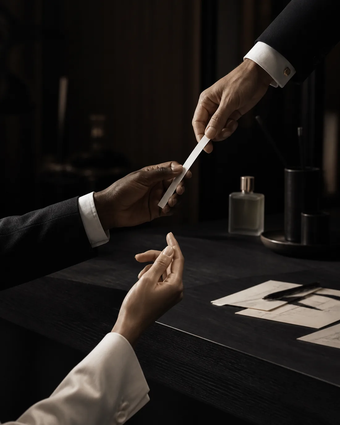 Fragrance expertise passed between specialists through a scent blotter